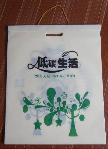 無(wú)紡布袋掛歷批發(fā)，無(wú)紡布掛歷訂做廠家